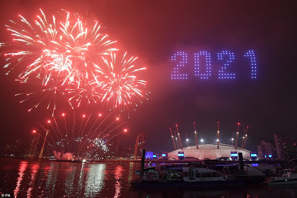 Mr Khan confirmed that the traditional fireworks show would not go ahead back in September, saying that 'we can't afford' to have large numbers of people congregating amid the coronavirus pandemic. Pictured: The alternative celebrations involved a light show and fireworks over the Millennium Dome and Tower Bridge