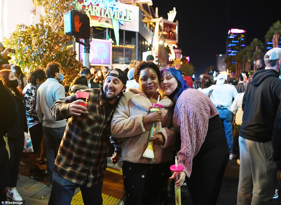 People take a selfie during a New Years Eve celebration on the Las Vegas Strip