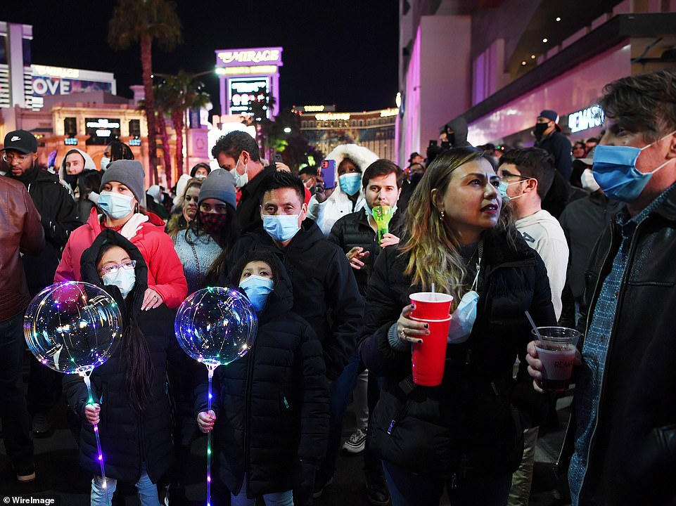 Revelers are seen above on the Las Vegas Strip as the clock counts down to midnight on New Year's Eve