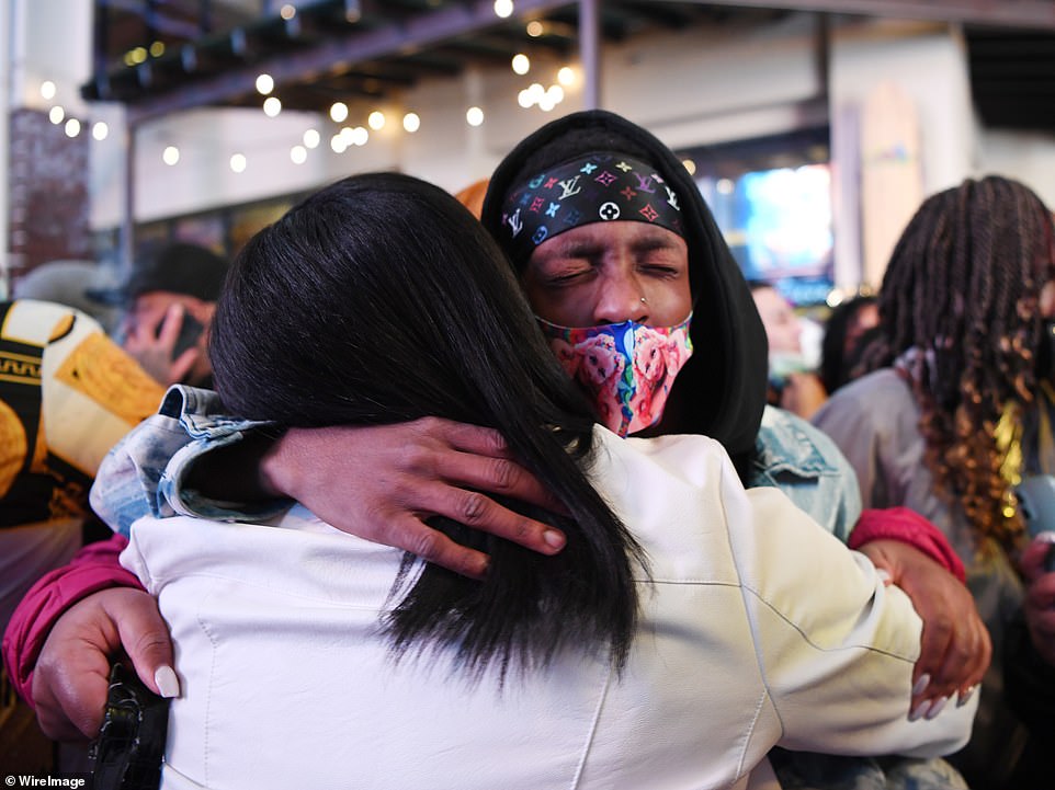Two people are seen in a warm embrace as they usher in the New Year on the Las Vegas Strip late on Thursday