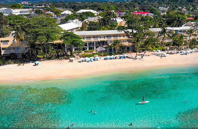 The pair were instructed to remain at their £300-a-night Sugar Bay resort hotel (pictured) after Zara's 30-year-old partner tested positive for the virus on Tuesday