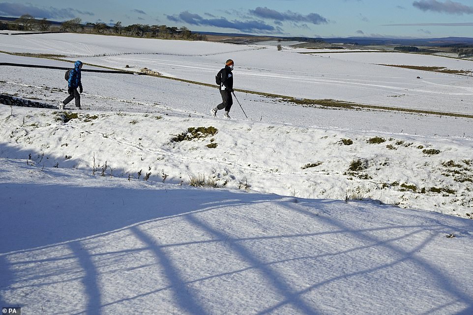 Hikers at Limestone Corner didn't let the snow keep them inside as they walked along Hadrian's Wall near Hexham
