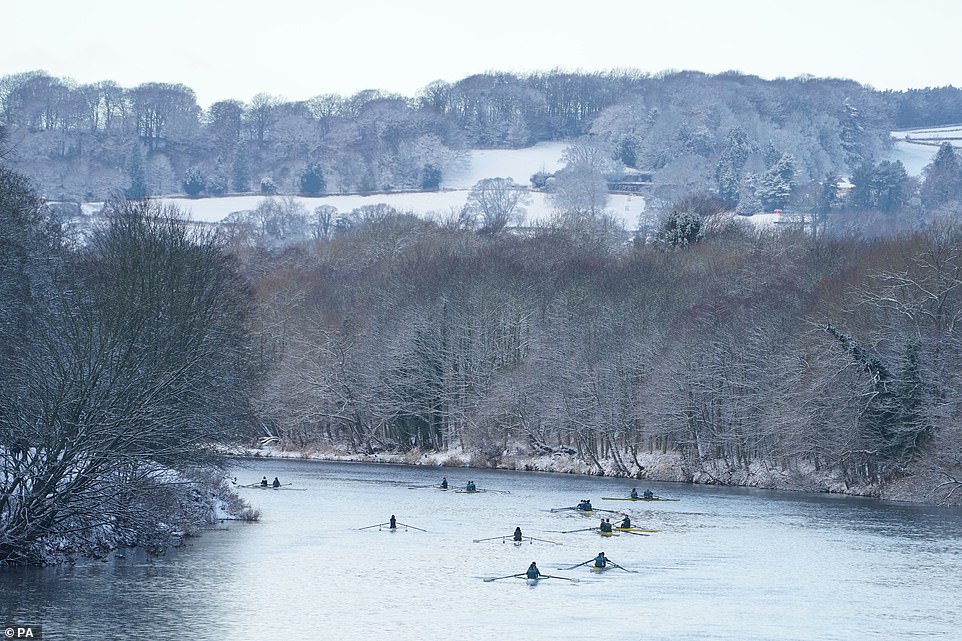 Rowers on the River Tyne at Hexham, Northumberland. The Met Office has issued a yellow weather warning for snow and ice which runs until 6pm on Saturday