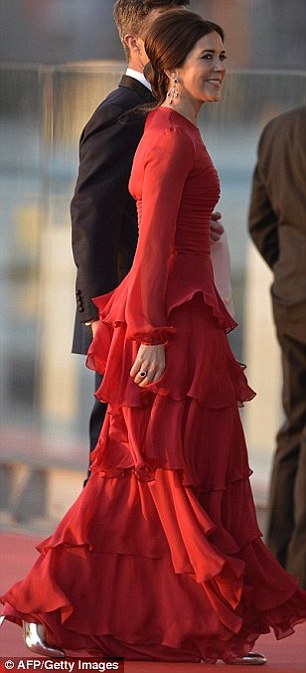 Red hot: Mary turned heads in this layered gown for a water pageant in 2013