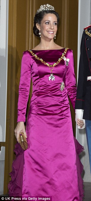 Frills and fuchsia: Marie had worn a similar dress a year earlier to a New Year's banquet in 2013