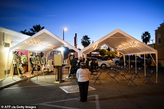 Funeral services are held for grandfather Gilberto Arreguin Camacho, who died due to Covid-19, at Continental Funeral Home on Wednesday in East Los Angeles, California