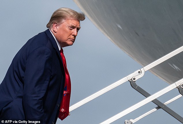 Donald Trump boards Airforce One while departing from Palm Beach International Airport in West Palm Beach, Florida on December 31. Trump tweeted Saturday morning urging his followers to get behind the two GOP Senate candidates David Perdue and Kelly Loeffler ahead of a last-ditch rally in Dalton, Georgia Monday night