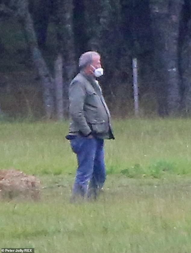 Staying safe: Jeremy is pictured in September 2020, filming The Grand Tour, taking COVID-19 precautions by social distancing and
 wearing a face mask