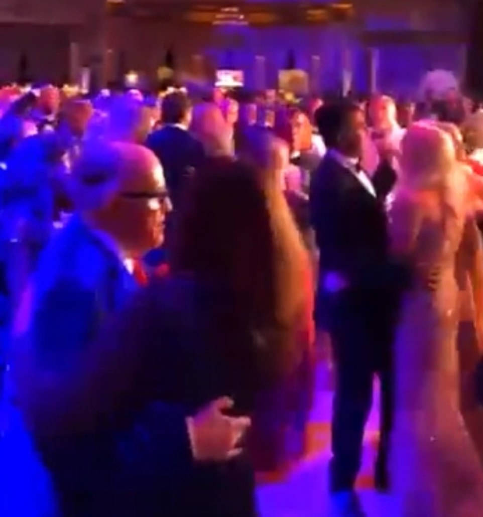 Also at the event was Trump's personal attorney and the man who spearheaded much of his election legal battle Rudy Giuliani who was spo
tted in separate footage slow dancing up close with a woman to Frank Sinatra's 'New York, New York'