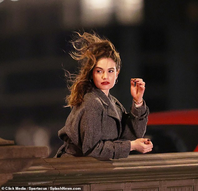 Dressed in a grey tweed coat and vampish blood-red lipstick and matching nail polish, she was filming scenes for her upcoming film 'What's Love Got To Do With It'
