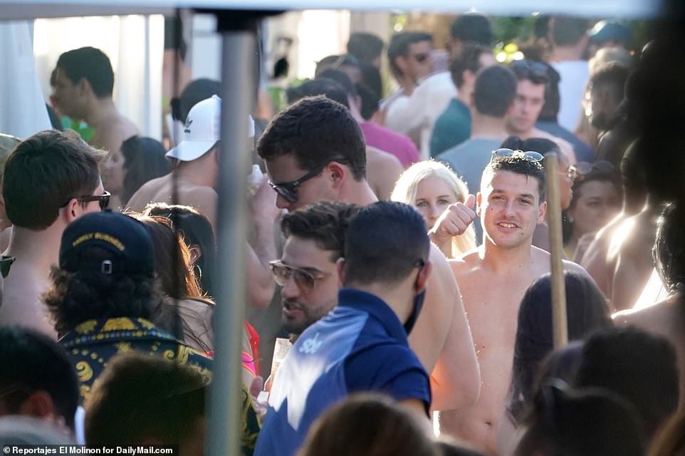 Not a mask in sight! Hundreds flocked to a South Beach hotel for a raucous pool party on Saturday afternoon