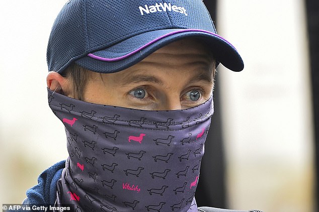 Joe Root watches on from behind his mask as England arrived at Rajapaksa Airport