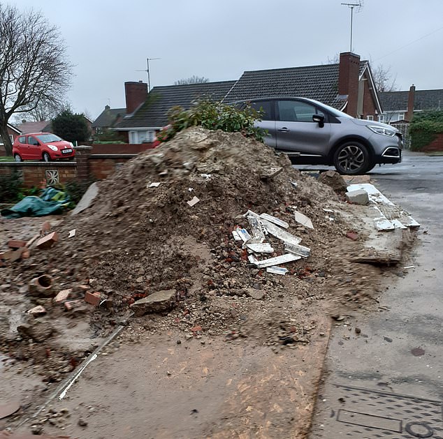 Waste that had been dumped in the front of the garden was not collected by the builder