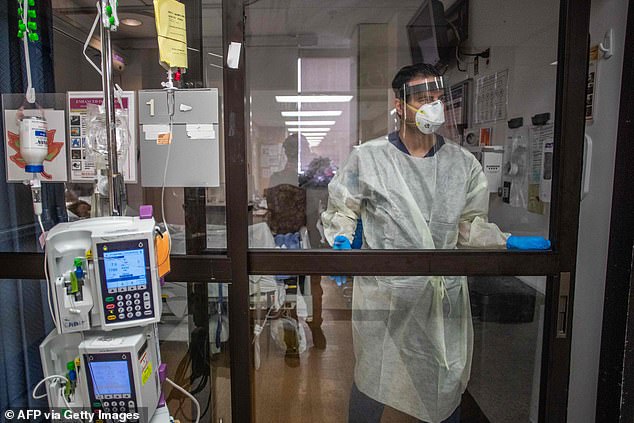 The outbreak comes as cases are surging in epicenter California with intensive care capacity dropping to 5.1 percent in the Bay Area on Saturday. A view of a nurse in PPE at the ICU at Providence Cedars-Sinai Tarzana Medical Center in Tarzana on December 18 above