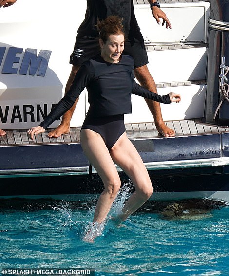 Dive: Nancy donned a navy long-sleeved swimsuit for the day as she joined her husband by going for a dive