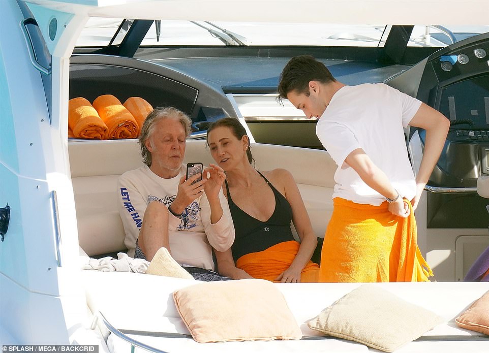 Couple: The couple also spent some time relaxing on the boat, with Paul sporting a white printed jumper and navy shorts as he sat alongside Nancy