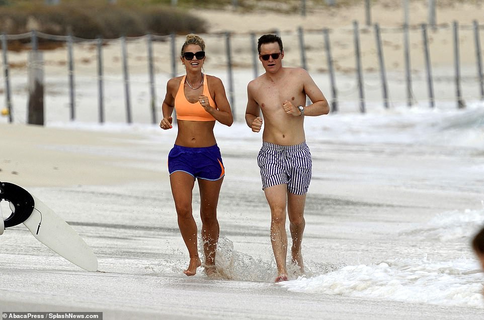 Vogue Williams shows off her enviable figure as she's seen with a friend jogging on the beach in St Barts, where celebrities are flocking to take advantage of relaxed Covid-19 restrictions