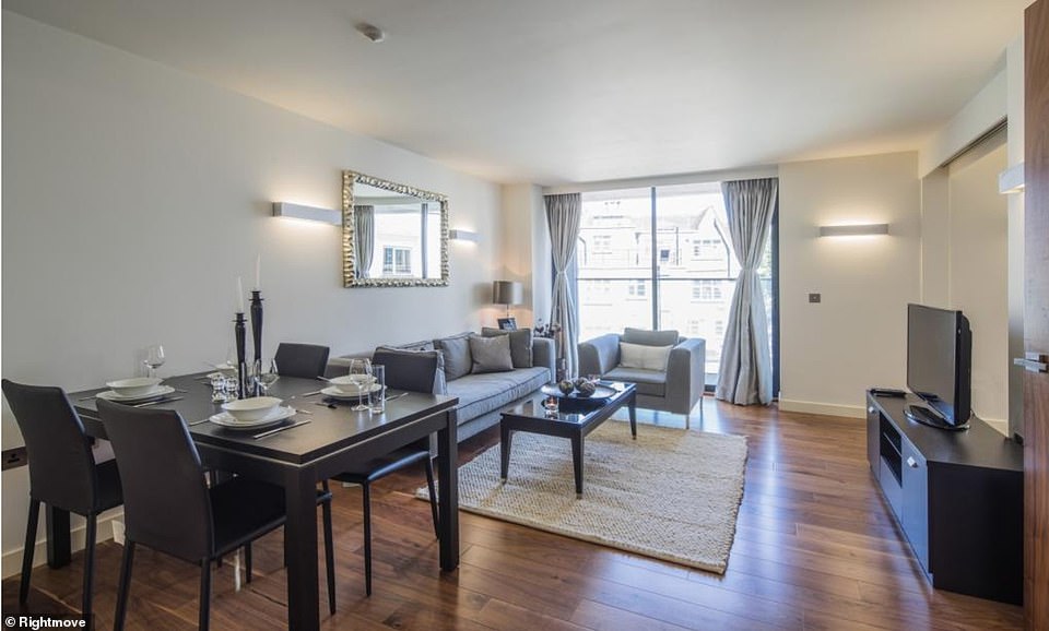 The apartment features a large open plan living area with hardwood floors, a utility room, a large private terrace, and two bathrooms