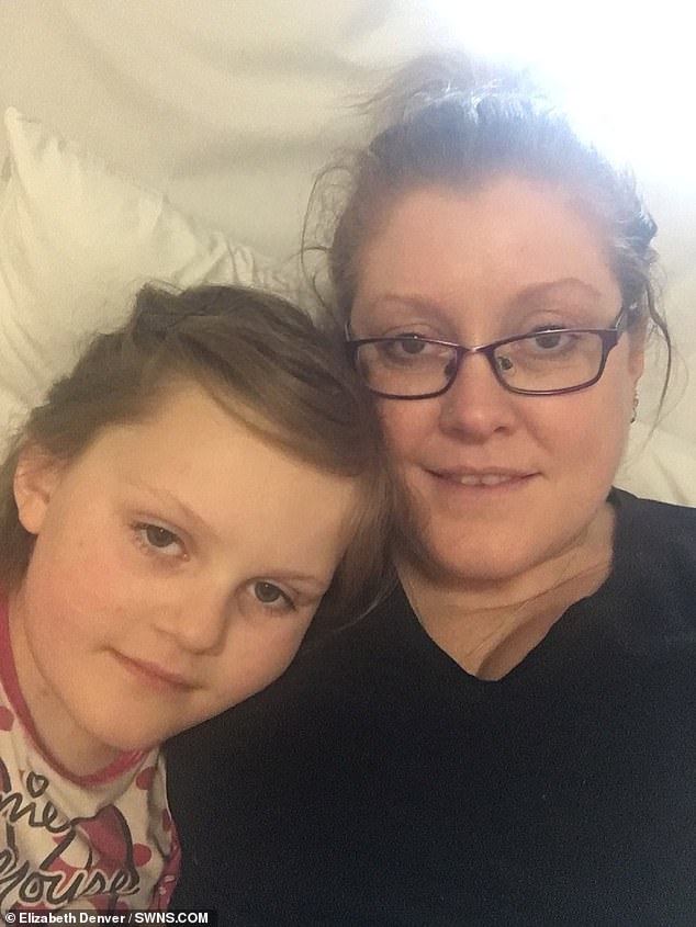 Mother-of-three Elizabeth Denver (pictured with Millie), 36, was concerned that the spots, she believed were chicken pox, were not blistering and called her GP