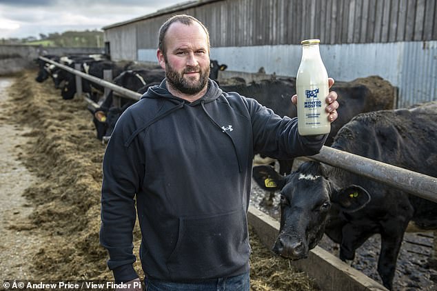 Einion Jones with the home produced milk they are now selling direct from the farm via a special dispensing machine
