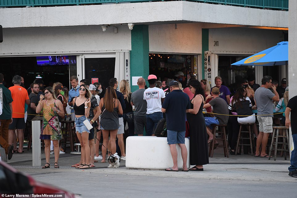Bars in Fort Lauderdale were packed with crowds on Sunday as they partied in close proximity to each other without masks or social distancing