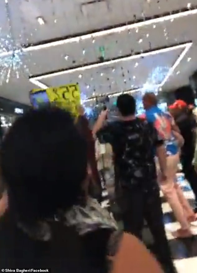 Several of the protesters are also seen chanting ‘no more masks’ while storming through a Bloomingdale's store