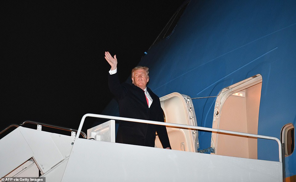 Trump waves to supports as he boards Air Force One before departing from Andrews Air Force Base in Maryland on January 4