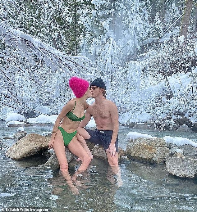 Fun colors: The 26-year-old daughter of Demi Moore and Bruce Willis was pictured in a bright pea green bikini with a hot pink cap as she posed in an icy cold stream