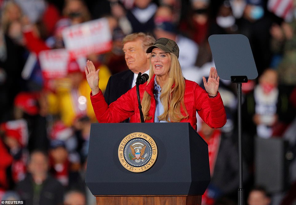 'This president fought for us, we're fighting for him. He put America first, he put the American worker first. He stood with our men and women in law enforcement. He restored our military,' Loeffler said as Trump smiled behind her