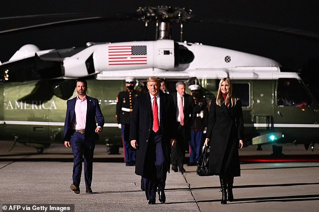 Trump, Ivanka Trump and Donald Trump Jr. make their way to board Air Force One before departing from Dobbins Air Reserve Base in Marietta, Georgia after the rally. Trump's presence at the event was cast in doubt in the wake of the leak of his phone call with Georgia Secretary of State Brad Raffensperger