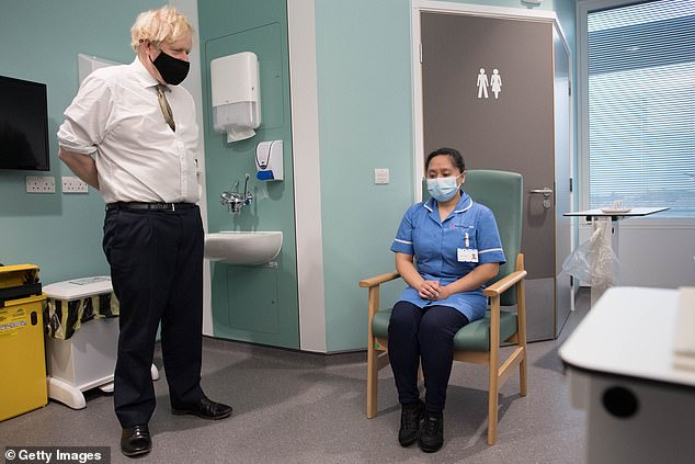 Boris Johnson pictured visiting the Chase Farm Hospital in London yesterday