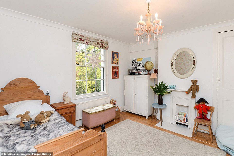 The house has been a successful photo shoot and film location but remains on the market after a year. Pictured is one of the house's single bedrooms