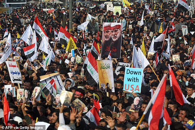 The latest tensions in the Gulf come after the January 3 anniversary of the US drone strike that killed Iranian general Qassem Soleimani (pictured, demonstrators in Baghdad where he died)