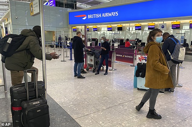 He urged the White House to 'shut down the danger now' and stop all travel to and from the UK (Pictured: British travelers shown waiting to board flights at Heathrow Airport on Jan. 2)