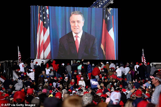 Perdue joined Monday night's rally remotely to address the crowd at one point. He is still quarantining at his home after contracting coroanvirus