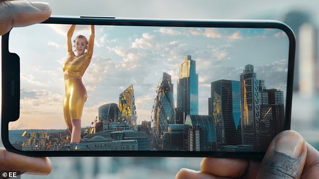 Not-so-golden girl: The advert saw Rita dancing and singing to her single Let You Love Me among London's picturesque skyscrapers, clad in an eye-catching gold jumpsuit. as an 'AR avatar'