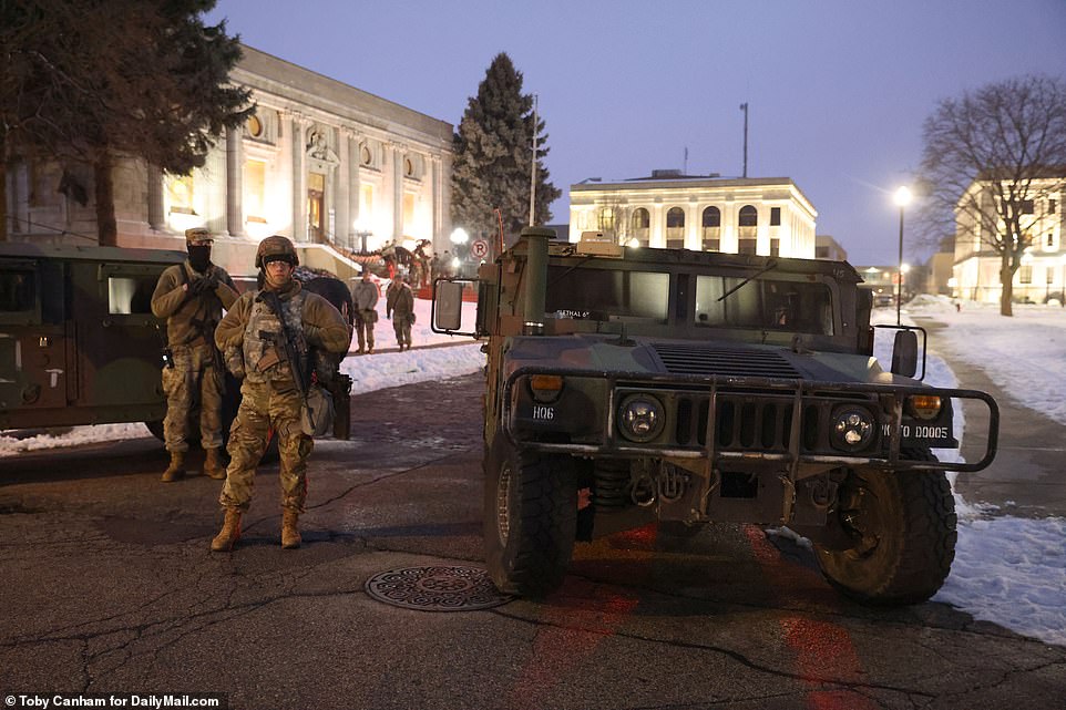 The National Guard is seen surrounding the Kenosha County Courthouse in a pre-emptive measure to deter any violent reaction