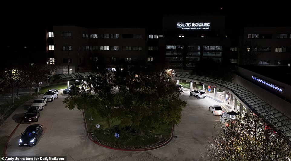 A line of cars is seen outside Los Robles Hospital and Medical Center in Thousand Oaks, California, on Tuesday