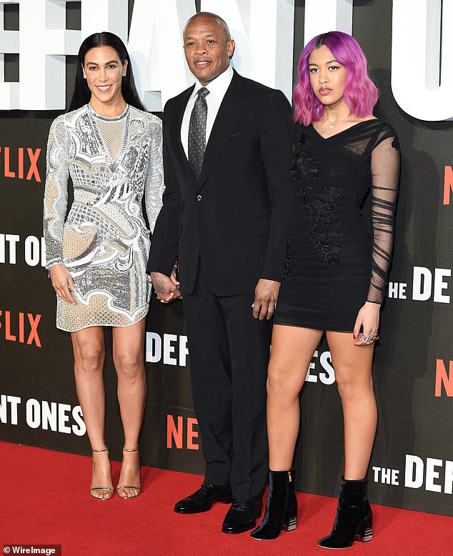 Dre is currently in the middle of a messy divorce and is attempting to work out a settlement with his estranged wife Nicole Young who is looking to receive $2 million a month from him; seen with Nicole, left, and daughter Truly, right, in 2018
