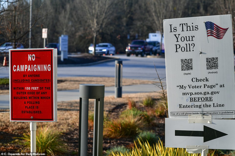 A sign outside a voting center reminds candidates and their surrogates, as well as anyone else, that campaigning within 150 feet of a polling place is prohibited by law