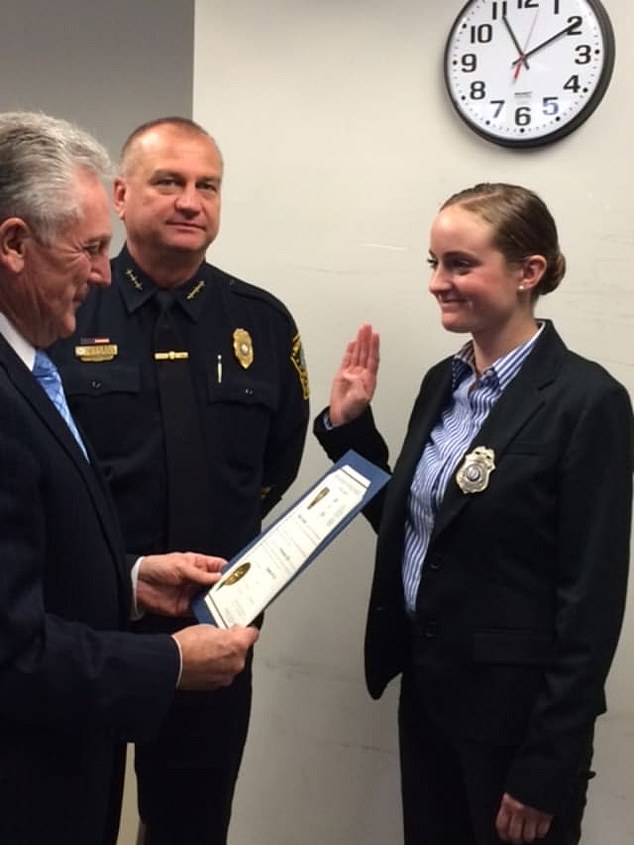 Laudano is pictured being sworn in as a police officer in 2015. She is facing charges of second-degree larceny, second-degree reckless endangerment and risk of injury to a child