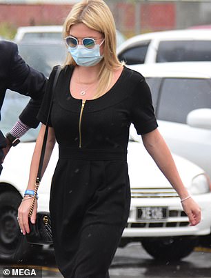 She was caught in a tropical rainstorm as she walked to the courthouse in Bridgetown, Barbados