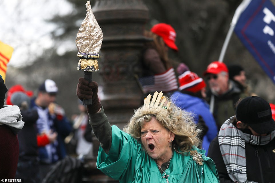 Outside the chaos in the capitol, another vocal Trump supporter Leigh Ann Luck, dressed up as the Statue of Liberty as she shouted in protest against Biden's victory