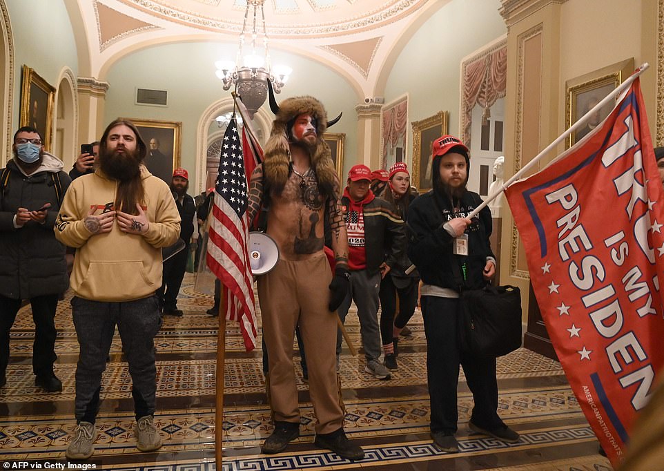 Angeli leads a mob of supporters breaking into the Capitol Wednesday night causing lawmakers to evacuate the chambers