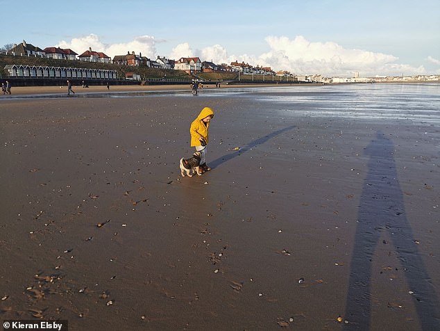 One of Kieran's children during a walk with Peppa by the seaside. The family are hoping to get their dog's ashes to spread them on the waterfront