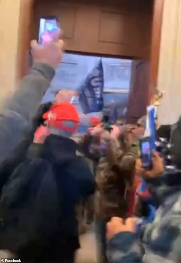 In a five-minute long clip that he posted to Facebook, Evans stands among other Trump supporters as they breach the front entrance to the US Capitol building