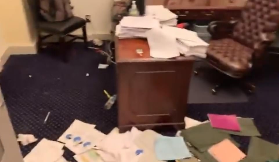 Dossiers are piled on the floor of an office after the Trump mob broke in on Wednesday evening and caused chaos