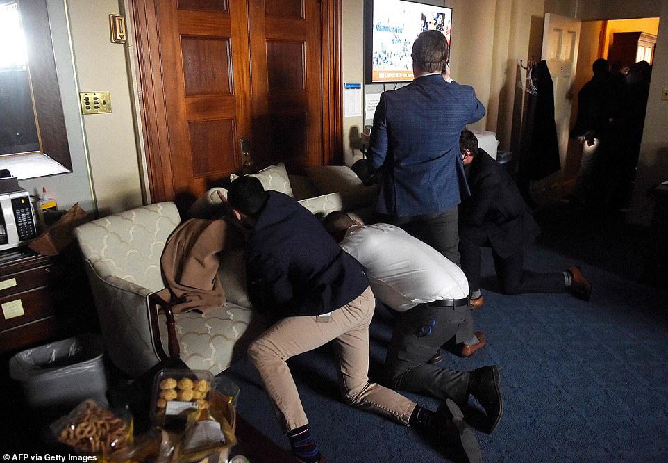 Congressional staffers barricade themselves inside their offices as Trump supporters rampage through the Capitol Building