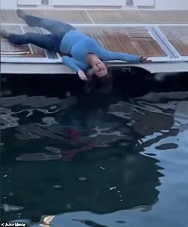 The woman seemed helpless as she rolled into the water in the dock in California