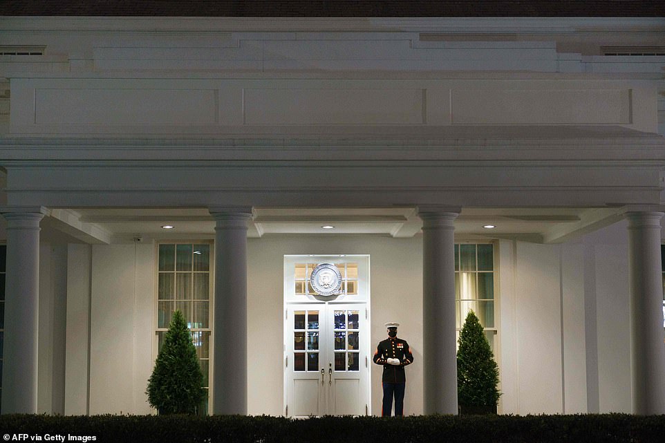 A US Marine stands guard outside of the West Wing of the White House in Washington, DC on January 6, 2020. The presence of the guard indicates that US President Donald Trump could be in the Oval Office